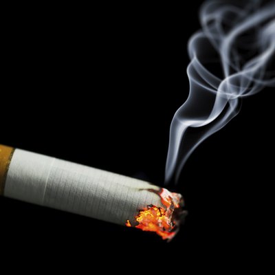 burning cigarette with smoke
