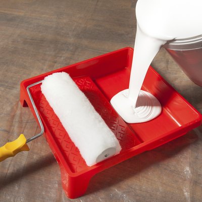 Pouring Paint In A Paint Tray