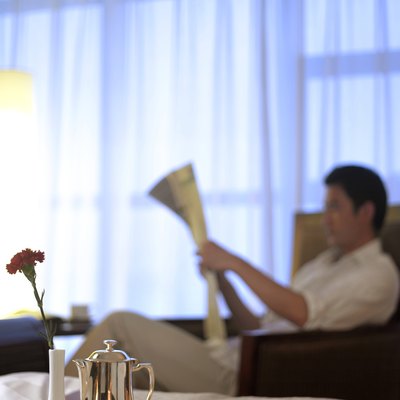 Room service tray, man reading newspaper