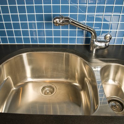 High angle view of kitchen sink by tiled wall