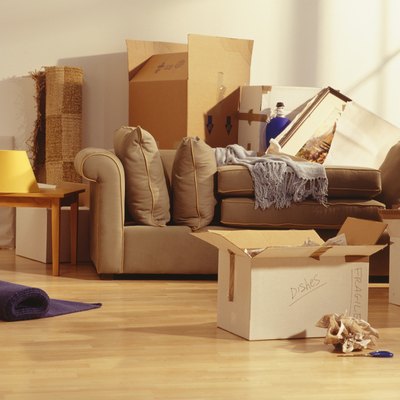 Unpacked moving boxes in Living Room
