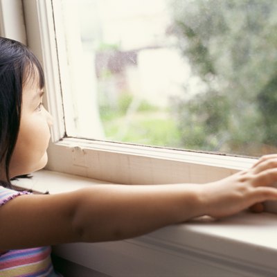 Girl looking out window
