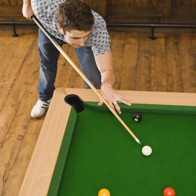 Man playing billiards