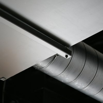 Low angle view of duct on ceiling in warehouse