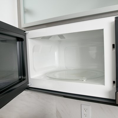 Open microwave oven in kitchen