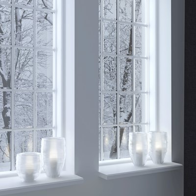 Candlesticks on a windowsill.