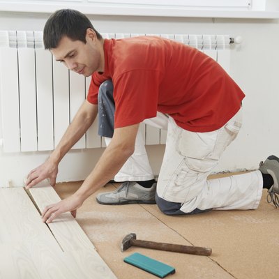 carpenter worker joining parket floor