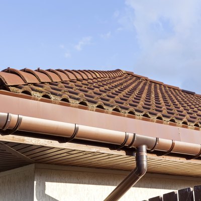 Red tiled roof with gutter and chimney