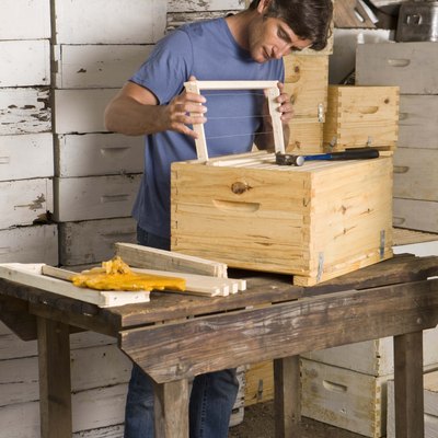 Man building beehives