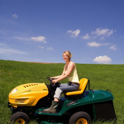 young girl on lawn mower 1