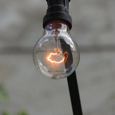 Clear incandescent bulb filament glowing.