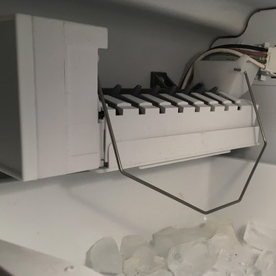 Icemaker filling the ice tray.