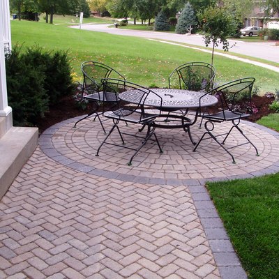 Front entry patio with round seating area.