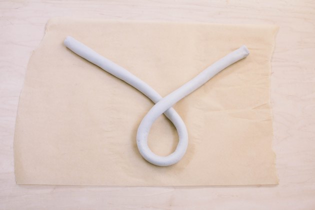 Tails of air dry clay shape crossed together