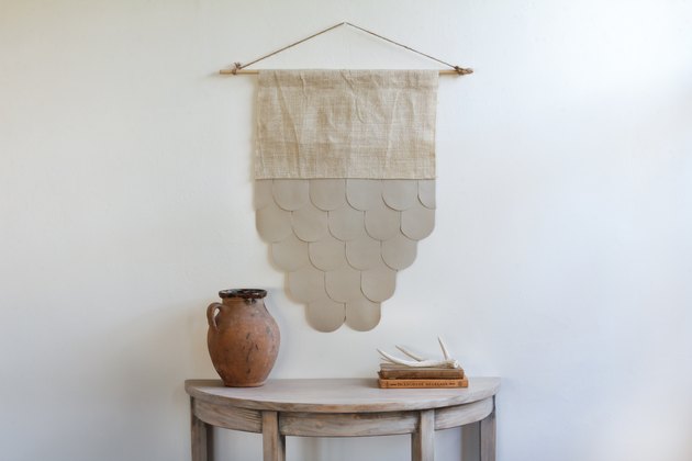 Scalloped leather and burlap wall hanging