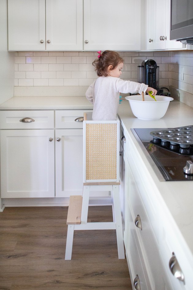 Young child using learning tower