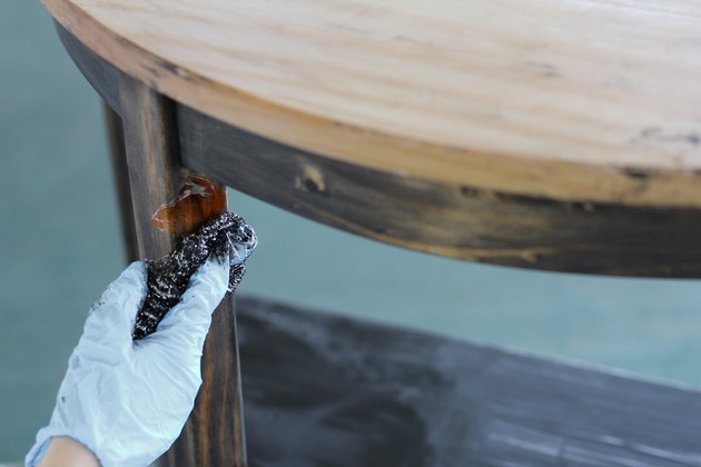 Scrubbing stripping gel with stainless steel scour pad