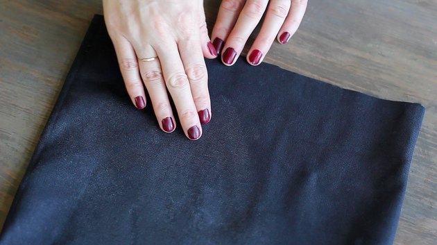Pressing wax into fabric with fingers