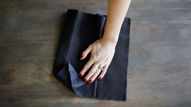Folding corner into triangle