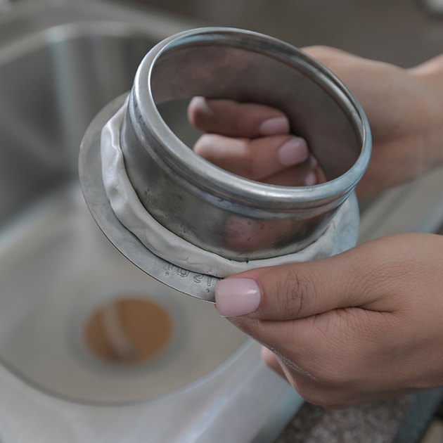 Garbage disposer sink sleeve.