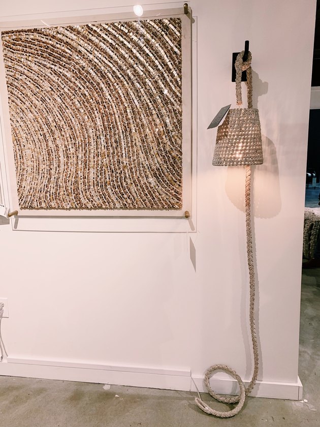 Palecek woven rope light fixture hanging from wall