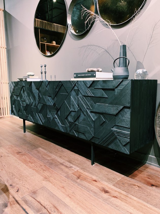 Ethnicraft cabinet with abstract raised surface on front of cabinet doors
