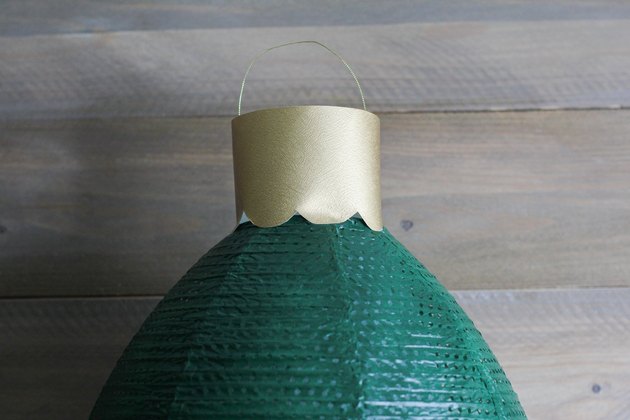 Top hook of ornament glued to top of ornament
