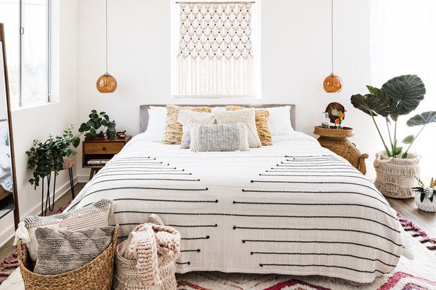 bedroom with boho decor and plants