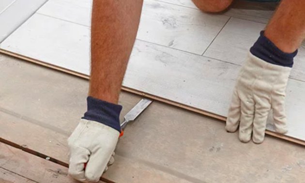 Removing laminate flooring.