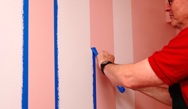 Removing tape after painting stripes.