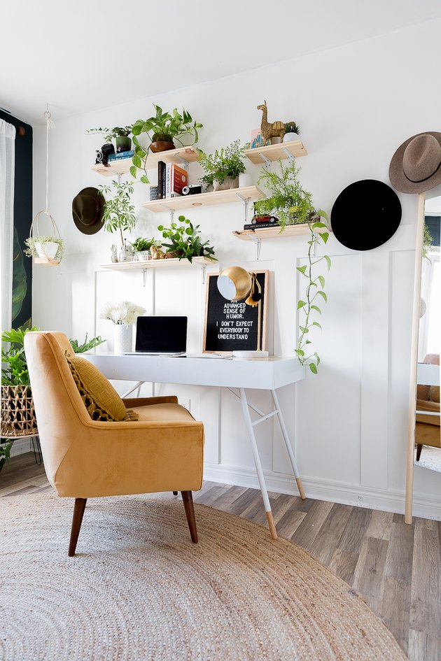 Boho office with houseplants and yellow chair