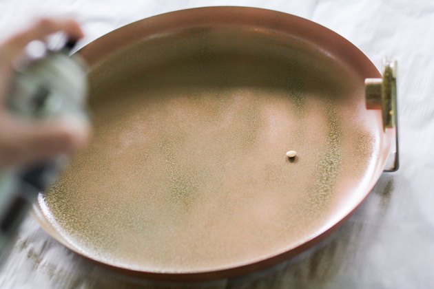 Spray painting platter with hammered gold paint