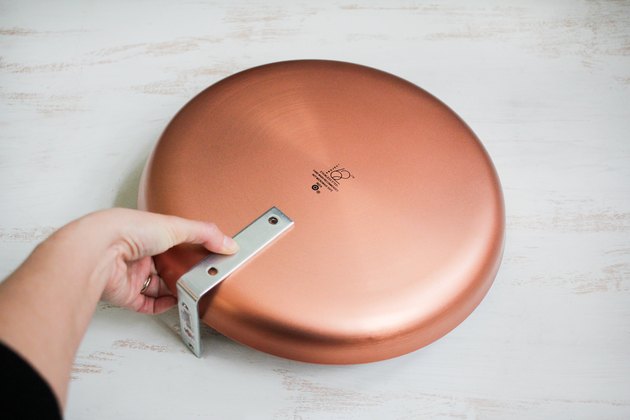 Placing corner brace onto platter