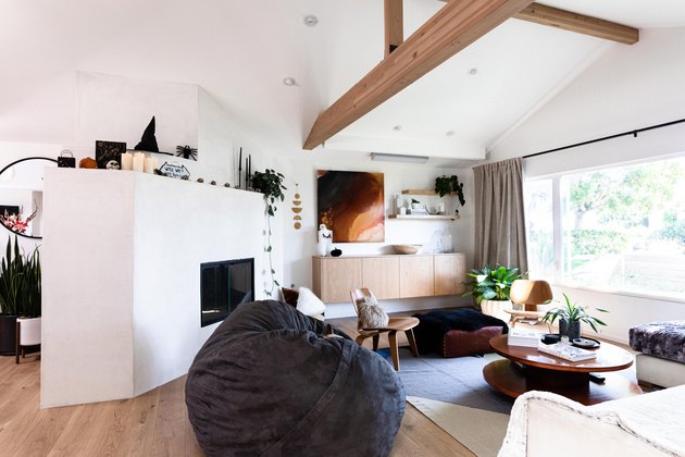 open concept living room with hardwood floors and fire place