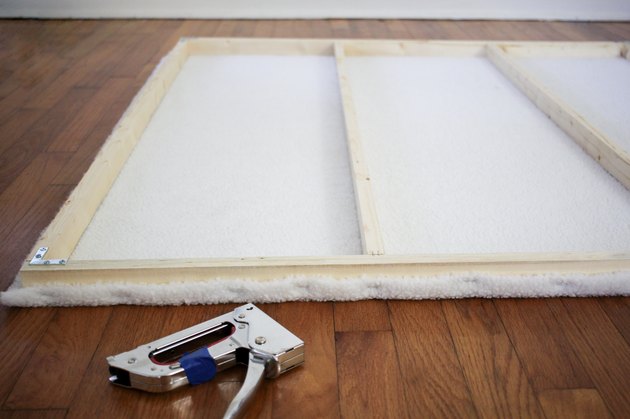 Stapling shearling fabric to the wood frame