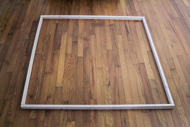 Four wood boards laid out to form a square