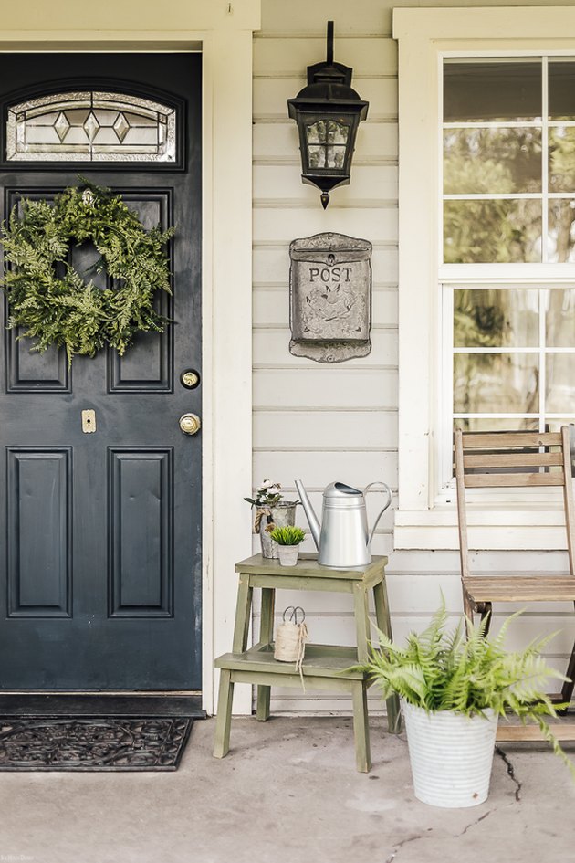 Farmhouse front door idea in navy with greenery and farmhouse decor ideas