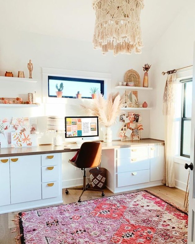 white boho office with pink rug on floor