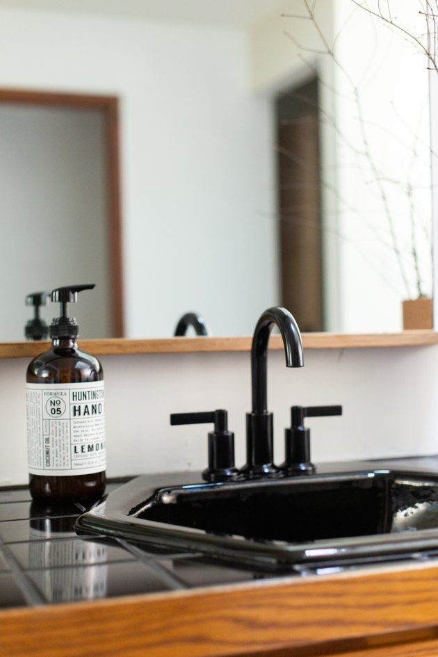 close up of black tile and sink