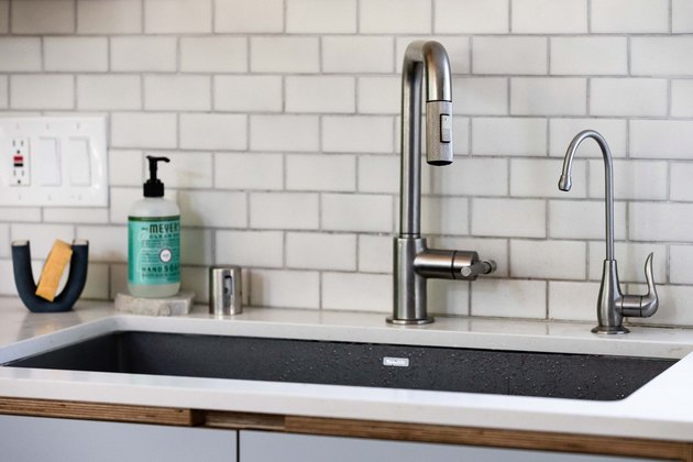 dark undermount sink with brushed nickel faucet