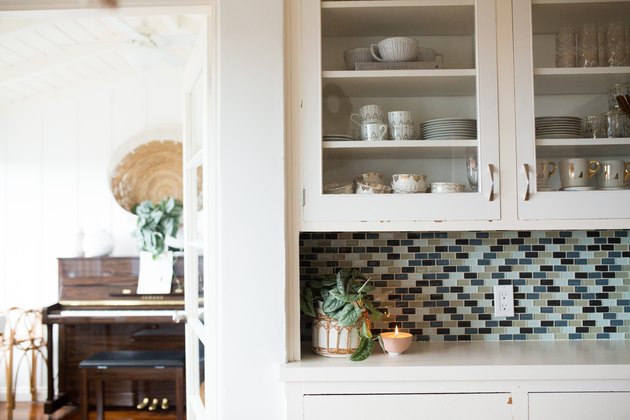close view of kitchen cabinets and tile backsplash