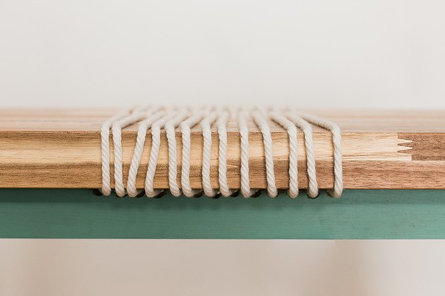 Run the rope around and through the bench seat to give it a cool linear focal point.