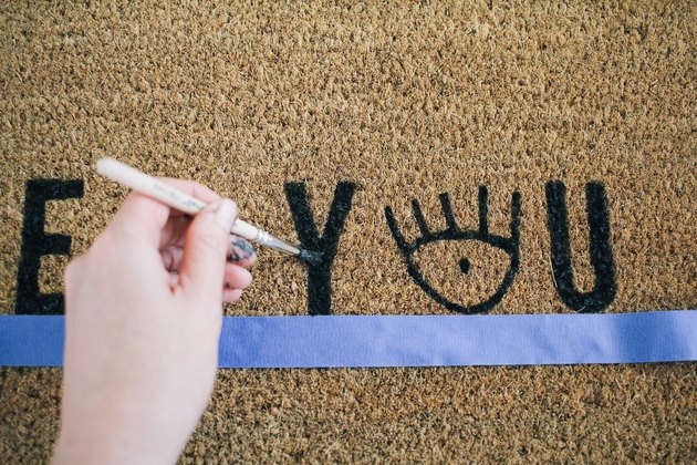 Touching up paint on doormat