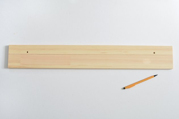 Wooden shelf with cut line drawn in pencil