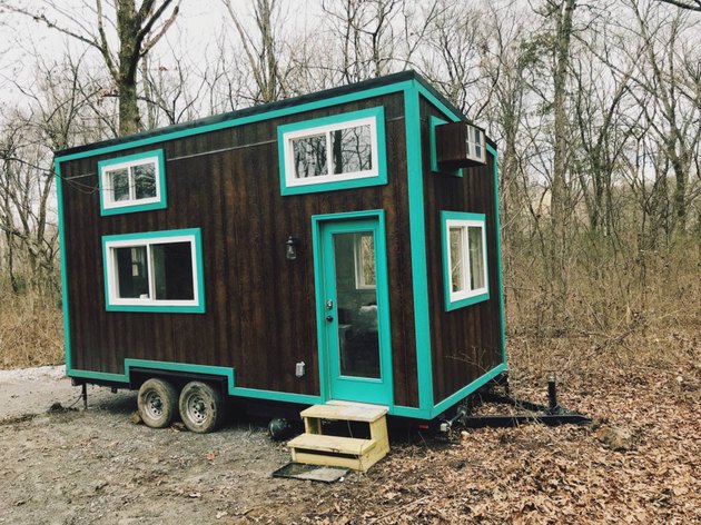 Tiny cabin with teal trim.