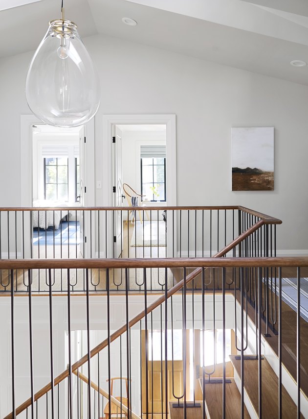 Modern staircase with glass pendant light