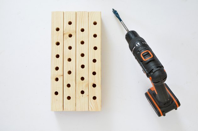 Bee house with holes drilled with power drill