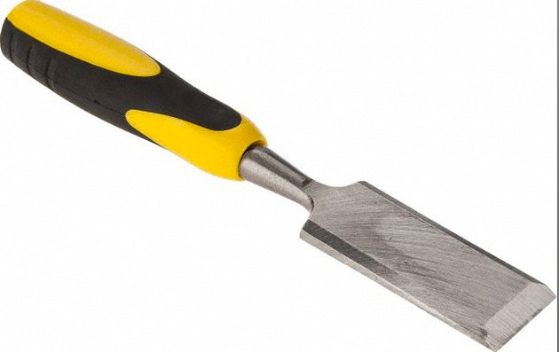 Wood chisel with plastic handle.