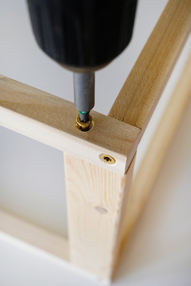 Place the screw in about 1 inch from the corner to prevent hitting the screw that is already in place.