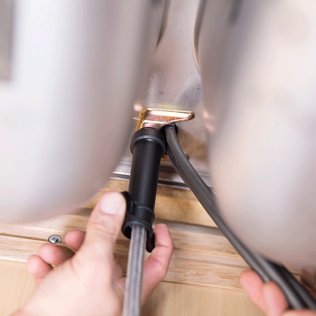 installing a kitchen faucet.